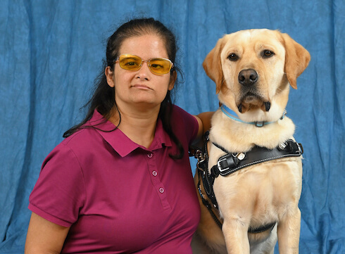 Graduate Caterina and yellow Lab guide dog Filo