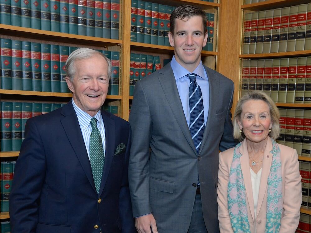 At a Golf outing Bill stands with wife Sandie and football great and future Board Member Eli Manning