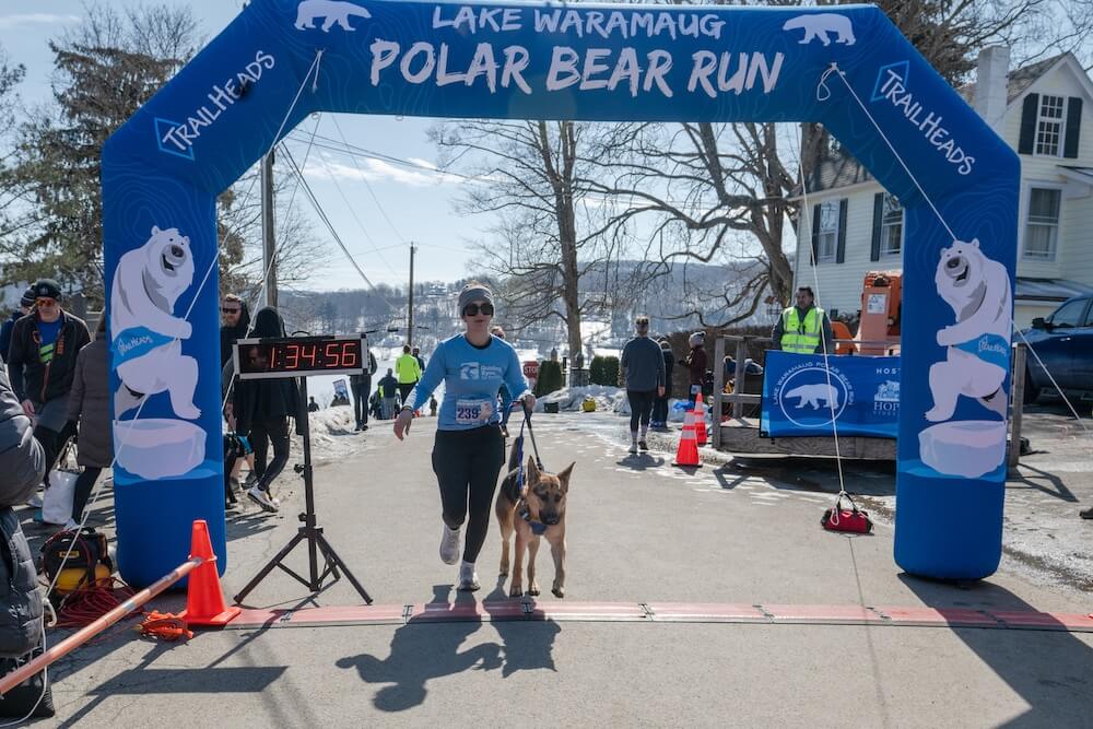 GDMI Trainee Jenna and guide dog in training Waltz run over the Finish Line